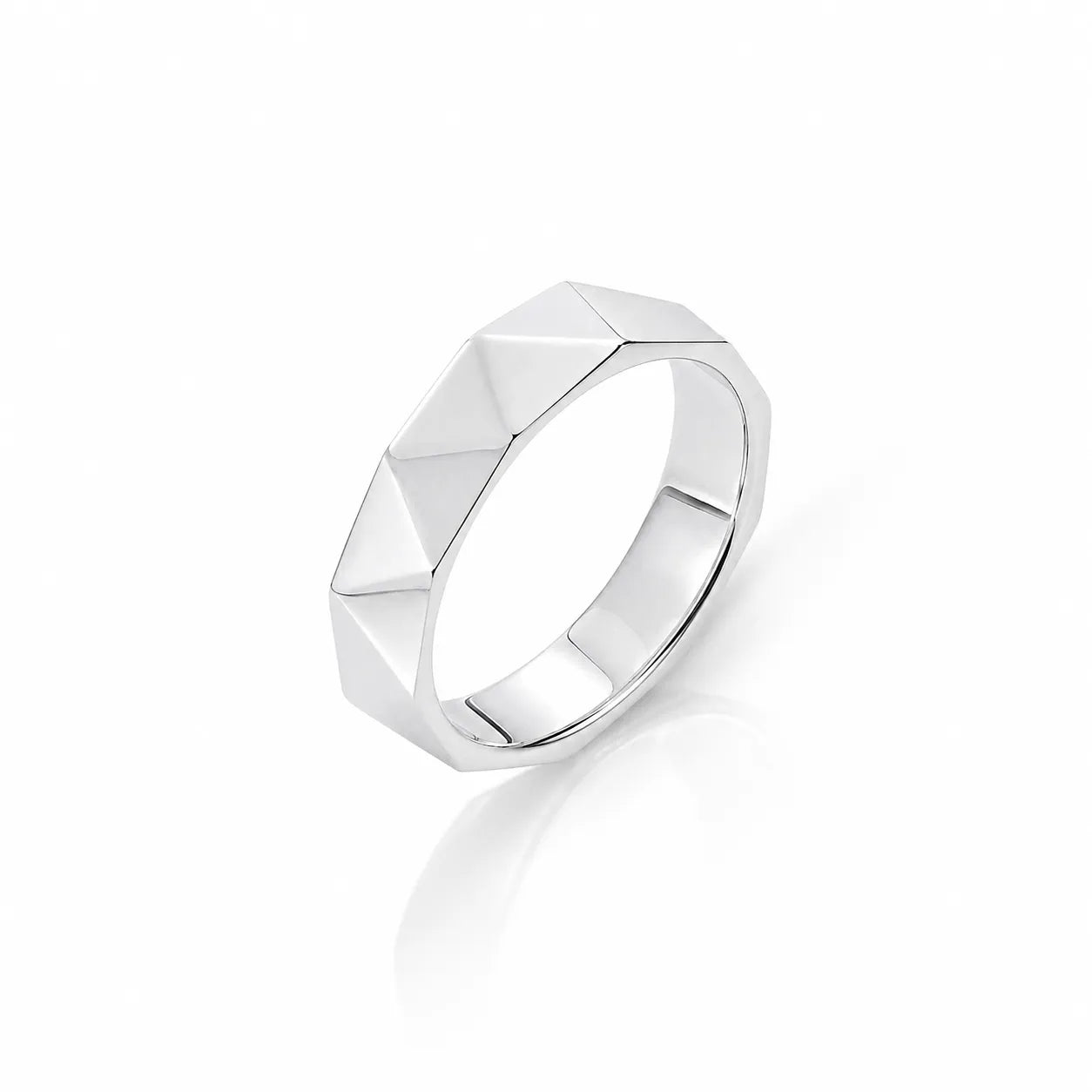 Silver ring with geometric design on a white background